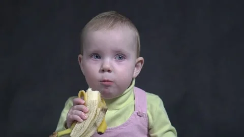 Slow Motion funny baby girl sitting in Stock Video Pond5