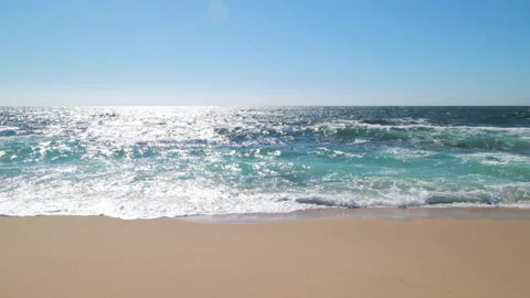 Slow motion gentle blue waves breaking on sandy beach in summer Stock Footage 132016972