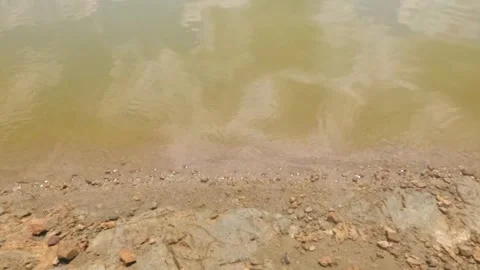 Slow motion of gentle ripples on the surface of the water lake Stock Footage 323149100