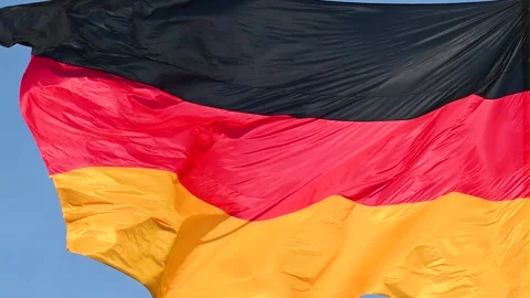 Slow motion of German flag flying on the wind. Waving flag in Berlin, Germany. Stock Footage 167223537