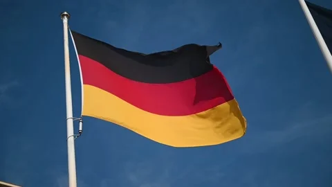 Slow motion of German flag waving in the wind. Flying black, red, yellow flag on Stock Footage 197048978