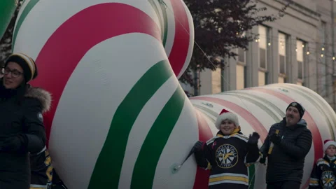 SLOW MOTION. Giant inflatable candy cane in Christmas Parade. Niagara Stock Footage 181909867