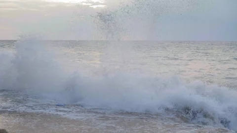 Slow motion of a giant wave with splashes and blue plastic garbage is crushing Video stock 114989419