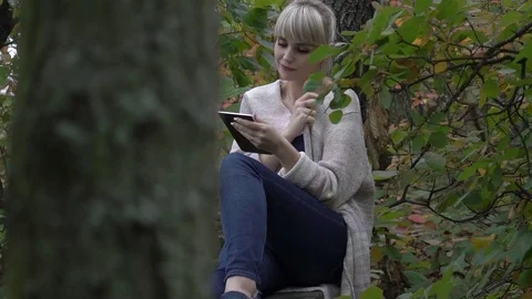 Slow Motion Girl Browsing Internet On Tablet  Stock Footage 82158743
