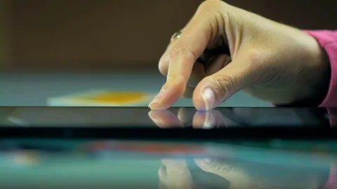 SLOW MOTION: girl chooses things in the online store on the tablet. Stock Footage 81663297