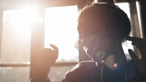 Slow-motion of Girl Dancing while Wearing Headphones 動画素材 109105325