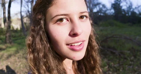 Slow motion of girl turning to camera and smiling, looking happy Stock Footage 54651353