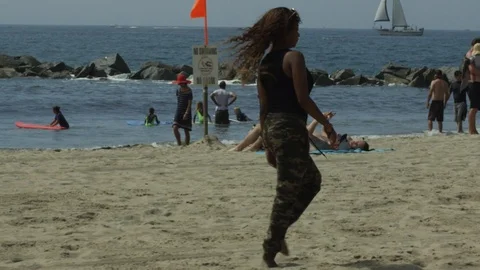 Slow Motion, Girl Walking On Beach, Kicking Sand Stock Footage 125963884