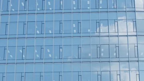 Slow motion of glass building reflecting sky in Seoul business area Stock Footage 313674731