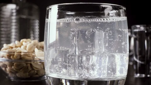 Slow motion a glass of vodka on the table with a snack Video stock 92033230