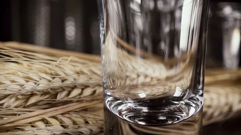 Slow motion a glass of vodka on the table with a snack Stock Footage 92033387