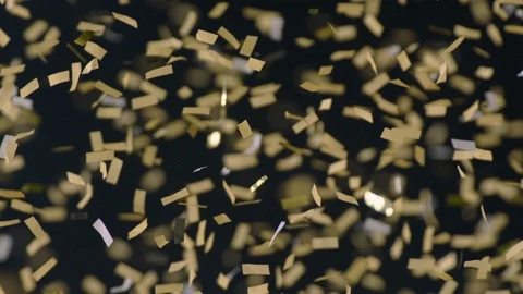 Slow motion gold confetti floating in air in stadium Stock Footage 104773482