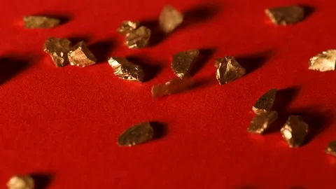Slow motion of a gold stones fall Stock Footage 142546977