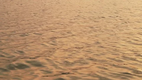 Slow motion of golden ocean waves background. Stock Footage 171412536
