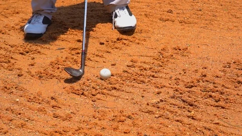 Slow motion golfer hitting swing golf ball on sand bunker in golf course Stock Footage 106858829