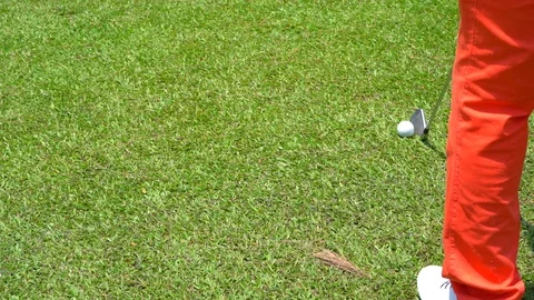 Slow motion golfer hitting swing golf ball on fairway in golf course 库存影片 106860634