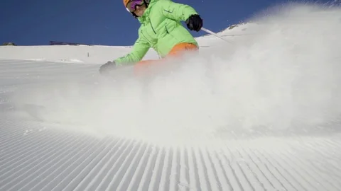 Slow motion good skier skiing and stopping with snow splashing Stock Footage 103997451