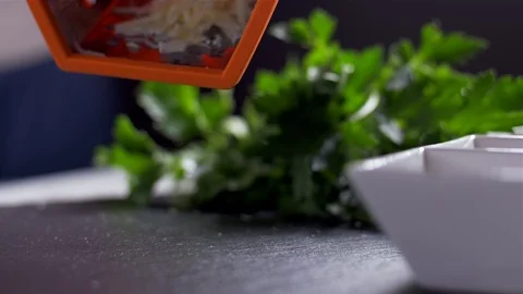 Slow motion of a  grated parmesan cheese, typical Italian cheese Stockbeeldmateriaal 106151985
