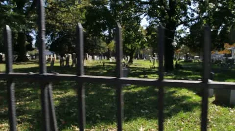 Slow Motion Graveyard Glide-Cam in front of fence Video stock 12029819