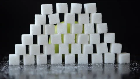 Slow Motion Green Apple Breaking Through Wall of Stacked White Sugar Cubes... Stock Footage 321422705