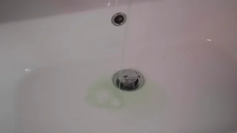 Slow motion of green liquid on the withe background Stock Footage 124639577