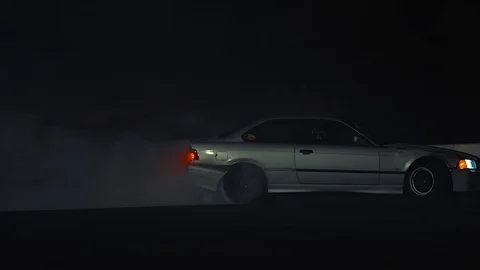 Slow motion grey car drifting toward camera Stock Footage 81520832