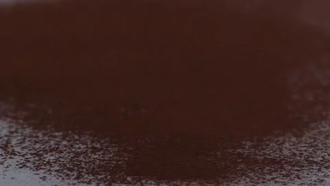 Slow motion of ground coffee dropping on clear white surface Stock Footage 157217622