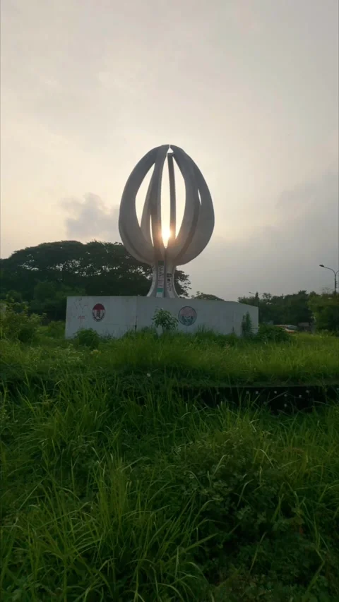 Slow Motion Ground-to-Sky Shot of Sculpture Monument at Sunset Stock Footage 312131201