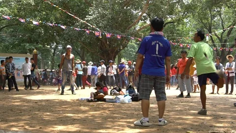 Slow motion of a group of Cambodians playing jianzi making filigrees-Dan Stock Footage 119056885