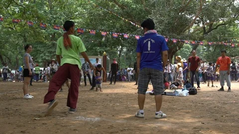 Slow motion of a group of cambodians playing jianzi in a Siem Reap's park-Dan Stock Footage 119056901