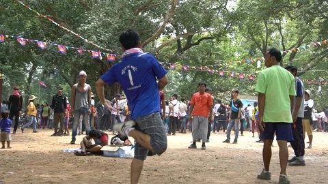 Slow motion of a group of cambodians playing badminton with his foots-Dan Stock Footage 119056904