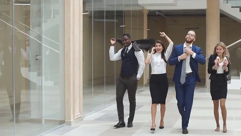 Slow motion. Group confident positive businesspeople exulting of winning Stock Footage 80261035