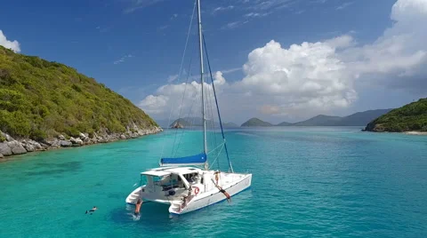 Slow motion group of people jumping off a catamaran Stock Footage 67570090