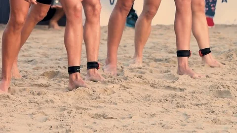 Slow-motion of a group of triathletes or swimmer legs started running to the  Stock Footage 126931755