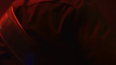 Slow motion of guitar/bass player from behind on stage Stock Footage 114644504