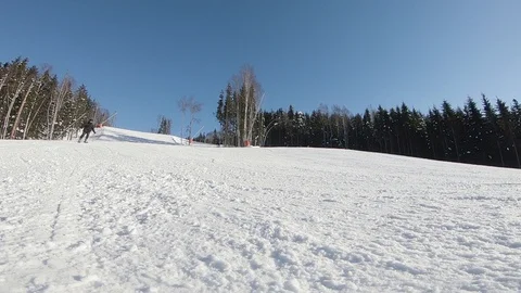 Slow motion of a guy carving on skis, skidding in a ski run Stock Footage 114226887