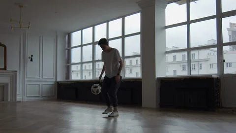 Slow motion. The guy does difficult tricks with the ball Stock Footage 126978749