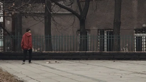 Slow motion: The guy is learning to skate Stock-Footage 91126855