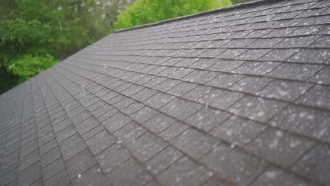 Slow motion hail storm hitting house roof causing storm damage Vídeos de archivo 129755177