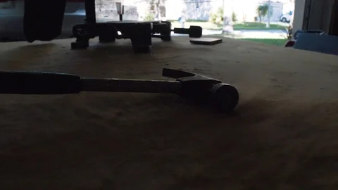 Slow Motion Hammer Dropping onto Dusty Table Stock Footage 97085786
