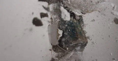 Slow motion hammer smashing through drywall in house renovations Stock Footage 62765656