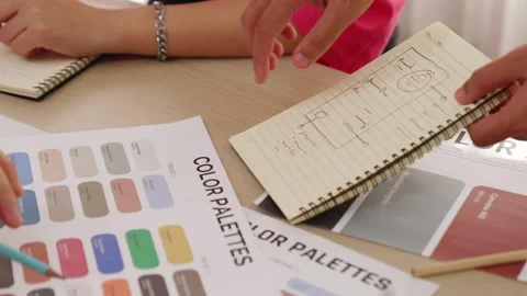 Slow motion hand closeup of two designer choosing color in office. Variegated Stock Footage 281195322