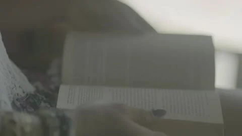 Slow Motion, Hand Closing the Book 스톡 동영상 131357229