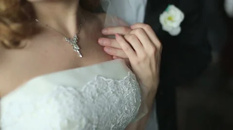 Slow Motion. Hand of the groom to the bride's shoulder, her hand on his arm. clo Stock Footage 47841375
