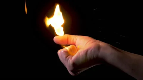Slow motion the hand holds fire in the palm of the hand Stock Footage 182484996