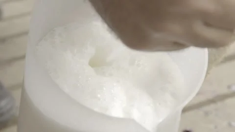 Slow Motion of Hand Milking a Goat (Cabra) on an Organic Farm Stock Footage 320633554