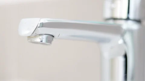 Slow motion of hand open and close water faucet in the sink in the restroom Stock Footage 124730227