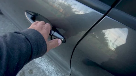 Slow motion, hand open a door car- Stock Footage 166794153