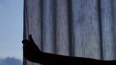Slow-motion of hand open window curtain to right of frame Stock Footage 120765737