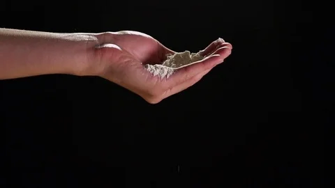 Slow Motion Hand Pouring Flour and Clapping Flour on Black Background Stock Footage 82149505